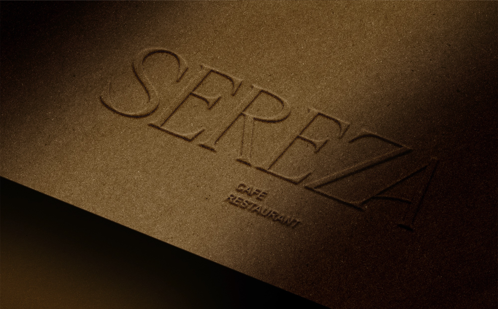 The Sereza serif wordmark embossed into warm brown paper
